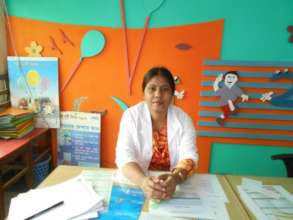 Naznin at her work desk