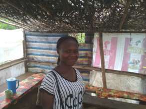 Jacinta in her small road restaurant