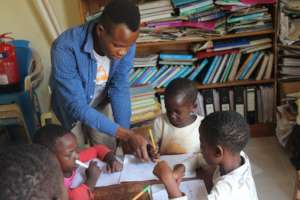 Young adult helping the young ones