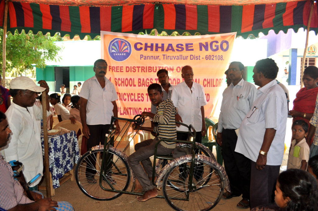 Tricycles,hearing aid,specs to poor disabled child