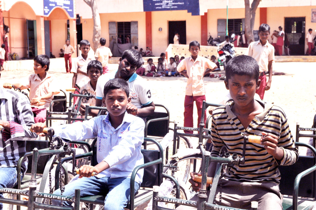 Tricycles,hearing aid,specs to poor disabled child