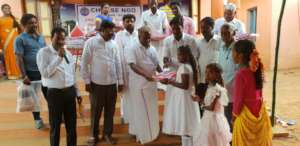 Children receiving school kit