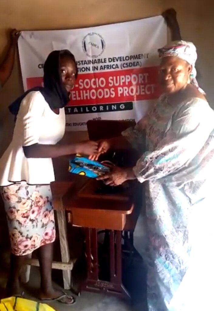 A girl receiving her sewing machine