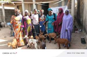 Women receiving goats for rearing