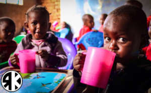Children of Valley enjoying uji (porridge)
