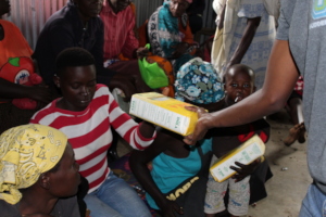 Community members receiving flour supplies
