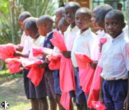 Happy faces after receiving new education packs