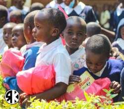 Students of Alendu receiving new education packs