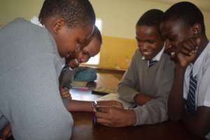 Students testing an LED Torch during an outreach