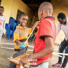 Boy having fun while making a rubber mop