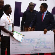 Pius (Sunflower Thresher) receiving his award