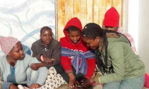 NGU student Coletha with children at TOM