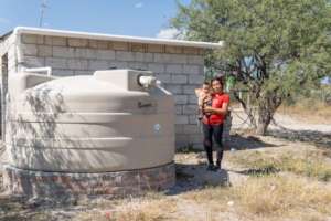 A young mother with her new rainwater system