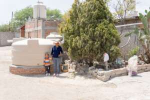 A women with her child in front of a new system