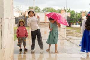 Girls Celebrating in the Rain in El Garabatillo