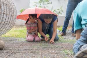Working on a rainwater system, under the elements