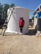 Waiting for the rains with her completed system