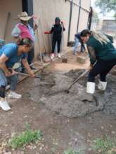 Women making the mix to make a ferrocement cistern