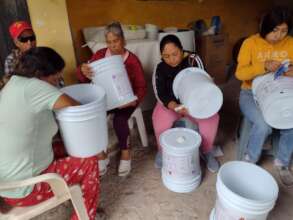 Assembling water filters during a training
