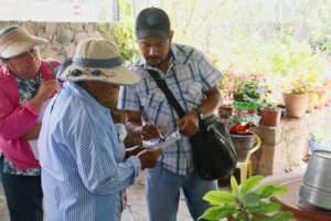 Caminos staff works with a local mother