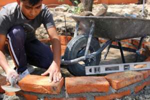 Student building a base in Agustin Gonzalez