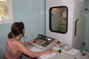 Kathy being tested in the sound-proof booth