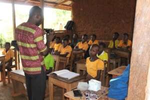 Arya (right) taking a class at the school