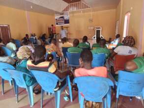 A municipal employee explaining about the grants