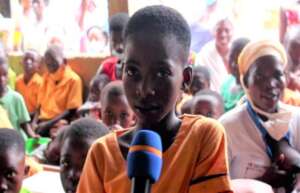 A girl speaks out at an event against Child Labor
