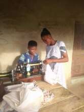 Abigail learning how to sew