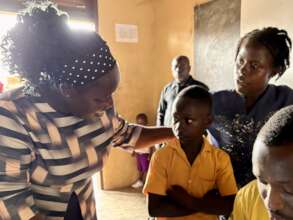 The principal checks in with a student.