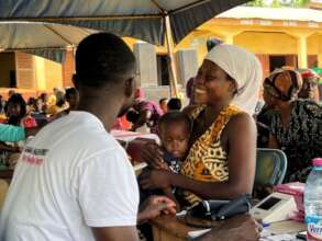 Zenabu receiving a health checkup