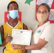 Wilmy receiving his certificate
