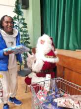 A young person happy with his gift at Christmas