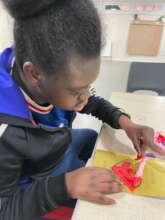 A child making a card in arts&craft at Monday Club