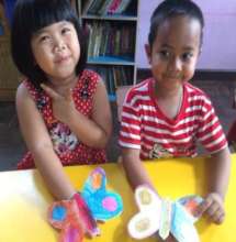 Pao with one many friends at the day care