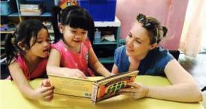 Reading with one of our volunteers
