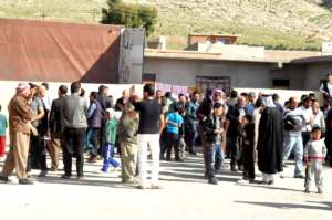 Crowd Gathers for Distribution