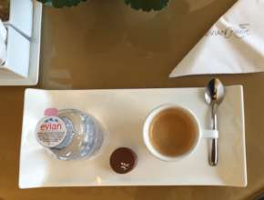 Served Evian Spring water, chocolate & espresso