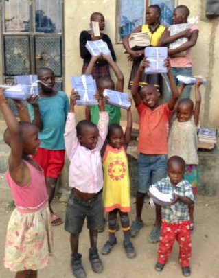 Happy children receiving supplies