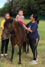 Briana at a horse-assisted therapy session