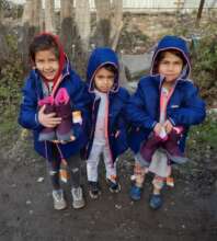 Refugiu, Romania: Children given coats and boots