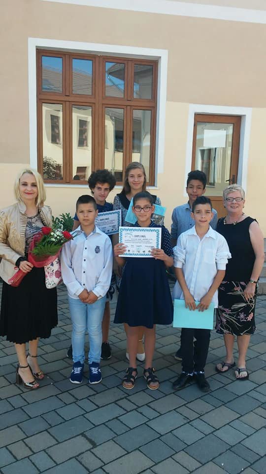 Kids from a Romanian home with school certificates