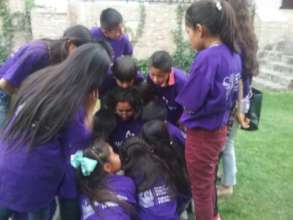Carla in the middle of kids