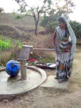 Filling the WaterWheel at a hand pump