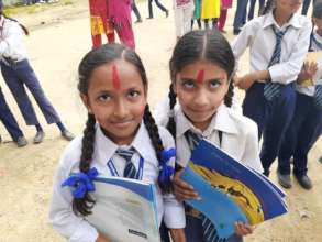 Students receiving books after exams