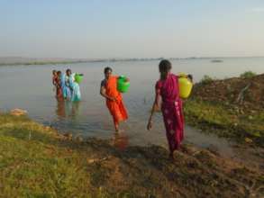Women collecting water from river