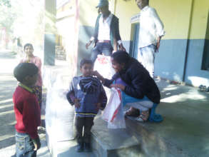 Child with his sweater at one of the orphanages