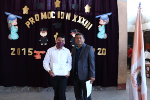 Oliver receiving his sixth grade diploma