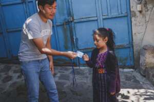 Elementary school student receiving education card